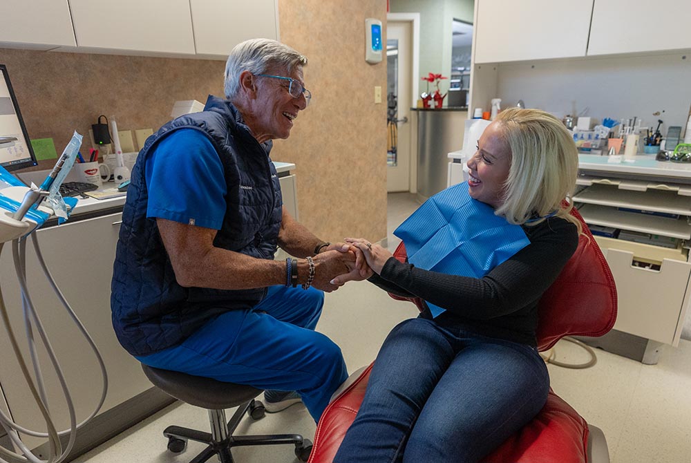 Dr. Stanley Levenson shakes the hand of a patient