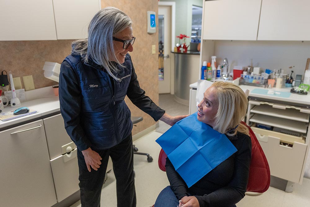 a dental staff shares a reassuring smile to a patient